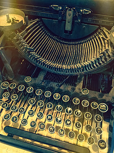 字母光效炫酷旧式打字机的密钥乡愁打印古董机器桌子字母光效键盘钥匙泄漏背景
