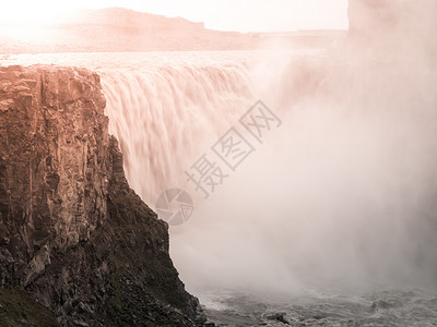 黛提瀑布冰岛北部日落所照亮的Detifos瀑布岩石薄雾力量旅行地标冰川旅游天空太阳戏剧性背景