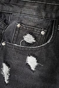 牛仔裤口袋短牛仔布黑色衣服服装纺织品灰色接缝棉布织物标签背景图片
