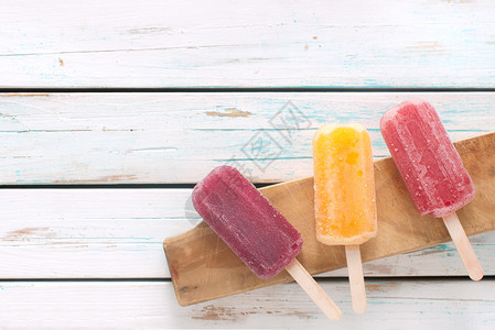 冰棒广告冰淇淋食物橙子甜点覆盆子小吃木头背景图片