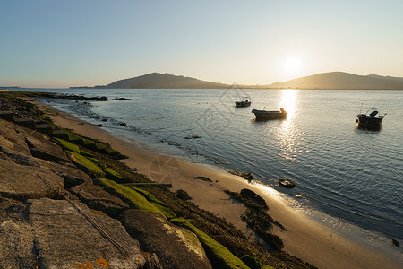 日落时低潮环境暗流运输旅行场景太阳海岸线宽慰山脉爬坡背景