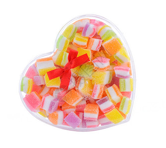 白色背景的多彩水果果冻糖果组装甜点明胶小吃红色食物背景图片