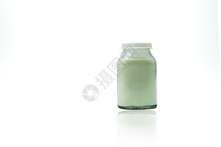 透明玻璃瓶中的绿色柠檬味泡腾粉 带有空白标签 复制空间隔离在白色背景上 医药包装行业背景图片