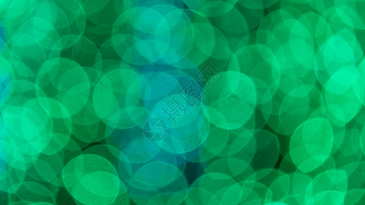 抽象的节日背景魔法墙纸白色辉光绿色星星圆圈耀斑背景图片