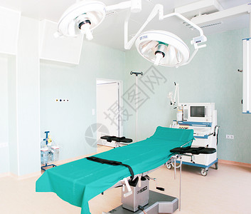 在现代医院的手术室里聚光灯手术工作诊所外科治疗疾病妇科房间背景图片