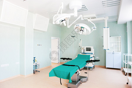 在现代医院的手术室里聚光灯诊所工作房间治疗手术妇科疾病外科背景图片