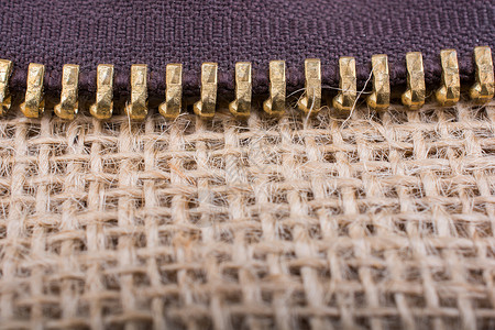 特写色彩多彩的拉链裁缝金属时尚压缩紧固件纺织品背景图片