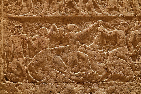 石墙 雕刻着古埃及堡垒的石墙古董砂岩棕色文明寺庙旅行浮雕风化艺术考古学背景图片