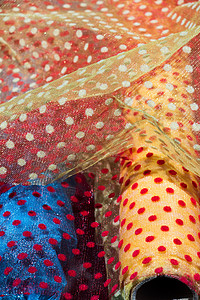 各种颜色和类型的织物示例材料店铺面料纺织品缝纫家具裁缝棉布背景图片