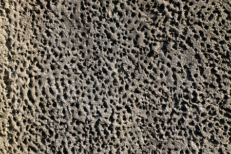 由深色大鹏制成的墙石头岩石背景地质学墙纸鹅卵石卵石背景图片