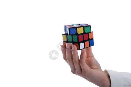鲁比克的立方体在手绿色形状方块红色游戏智力魔方教育拼图学习背景图片