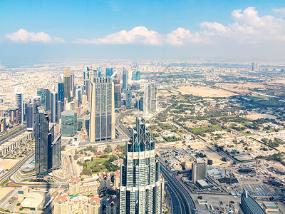 杜拜从世界上最高的建筑布吉哈利法塔上商业天线地标全景建造中心摩天大楼天空城市哈里发背景图片