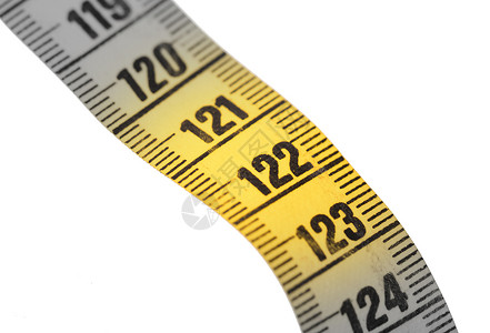 特写白色上隔离的黄色测量带  122裁缝带卷尺测量饮食磁带剪裁尺寸数字损失水平背景