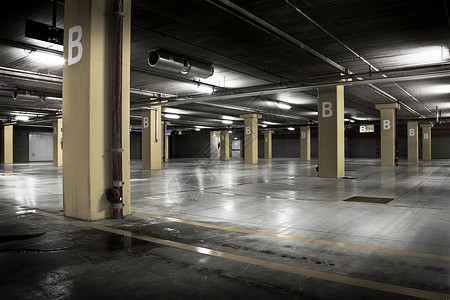 空的大型地下地下停车场筒仓概念中心公民商业车库交通公园背景图片