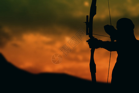 射箭剪影运动员前视线正在练射箭黑色橙子肌肉运动天空男人射箭专注练习男性背景
