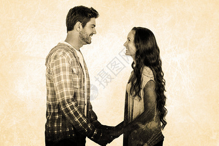 微笑的情侣相互牵手看着对方的复合形象 笑声人类框架主题背景图片