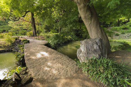 大石桥 叫做池塘上的图格素桥树叶水平传统木头花园文化摊位树木历史性太阳背景图片