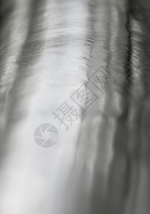 闪亮的表面和不锈钢上的划痕工业材料圆形拉丝白色金属曲线背景图片