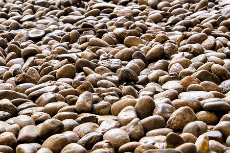 walkwa河石的质地圆形人行道卵石材料岩石灰色碎石花园地面鹅卵石背景图片