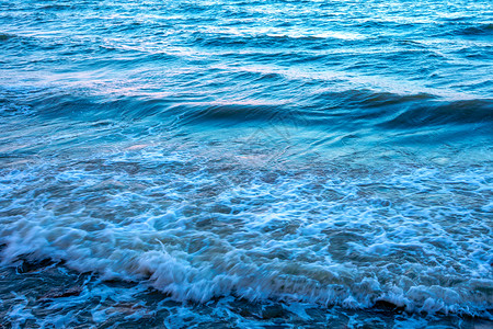 机芯表面的光反射波纹白色日落热带海洋海滩海浪背景图片