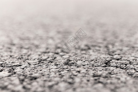 Aspalt  Road 聚焦于背景模糊的前方街道地面交通材料黑色背景图片