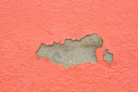 裂洞旧油漆和墙裂墙颜色橙色石膏宏观建筑学剥皮历史照片损害艺术裂缝材料背景