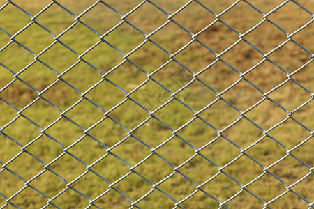 金属栅栏网纤维塑料绿色植物工业废料栅栏安全艺术监狱警察局背景图片