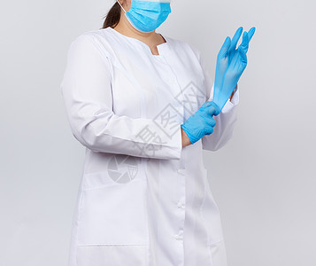 身穿白外套和面具的医生将手放在医疗手上病人外科医院诊所手套女孩卫生治疗手臂程序女性高清图片素材