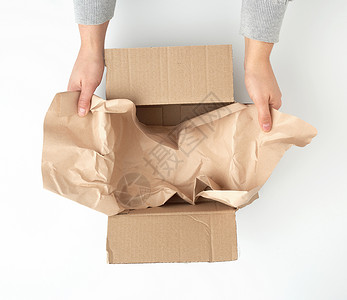 用于运输和快捷键的空平面棕色纸板盒店铺应付正方形商业纸盒船运邮件回收货物牛皮纸背景图片