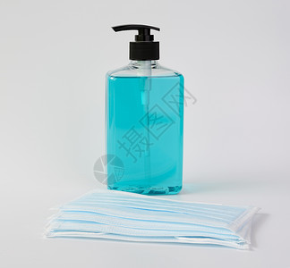 医用凝胶使用蓝色面罩和凝胶酒精或h的Corona病毒菌种保护剂清洁剂帮助流感卫生消毒液体塑料瓶口罩凝胶肥皂背景