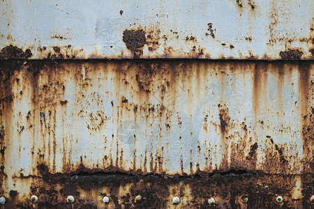 旧金属墙纹理背景上的锈迹工业墙纸材料棕色腐蚀红色橙子衰变蓝色背景图片