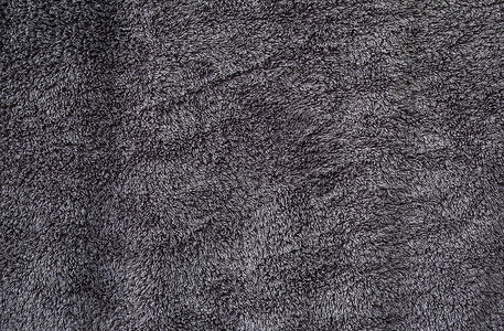 灰色蓬松棉质毛巾布的质地背景图片