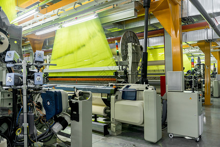 工厂的编织车间纤维作坊纺纱生产纺织棉布技术工业筒管织机植物高清图片素材