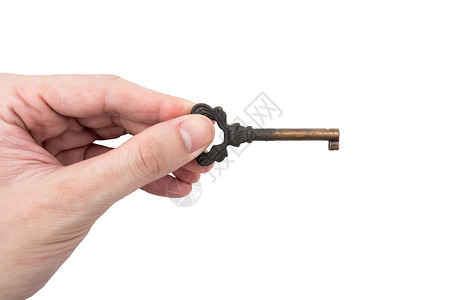 男性手持白色背景的金属钥匙秘密安全手指知识背景图片