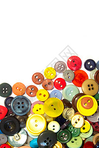 多色不同尺寸按钮的集合纽扣维修工艺圆形白色收藏绿色黄色衣服裁缝背景图片