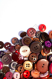多色不同尺寸按钮的集合红色塑料衣服工艺缝纫维修裁缝纺织品收藏纽扣背景图片