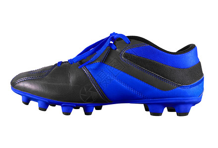 孤立的足球靴-深蓝色背景图片