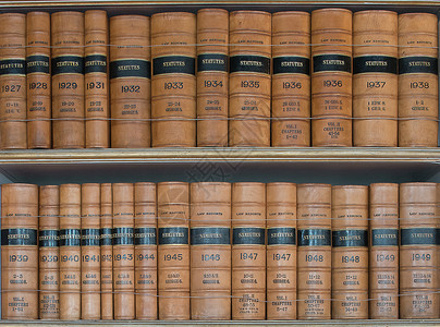 规约书体积架子棕色年度古董图书馆边界遗产法律报告背景图片