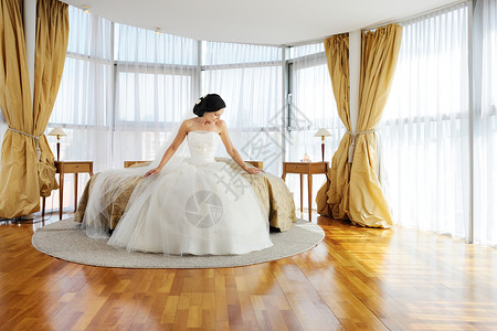 在酒店房间的美丽新娘工作室福利座位冒充闺房婚姻魅力女孩诱惑奢华背景图片