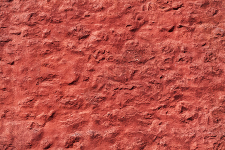 老红色被风化的粗砺的墙壁纹理摄影石头建筑学建造业建筑水泥石工石膏砖墙建造背景图片