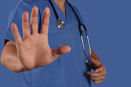 具有蓝背景的精巧医师工作成绩优异病人疼痛操作护士情况团体外套治疗学生医生背景图片
