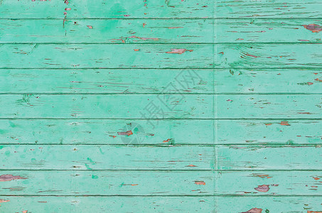 有剥落痛苦的老绿色木板条背景图片