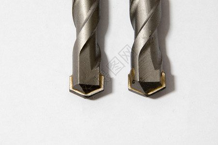 梅森里钻孔比特力量白色金属钻孔石工宏观工业灰色硬件工具背景图片