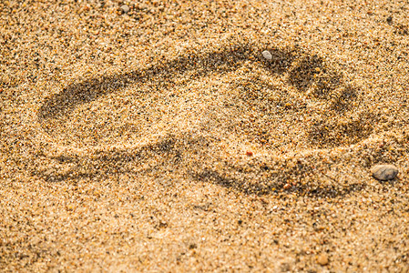 海滩上的足迹赤脚棕色背景图片