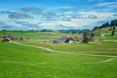 瑞士农场乡边 山区 绿草田和瑞典的住宅假期土地高山风景山脉场地森林旅游农场天空背景