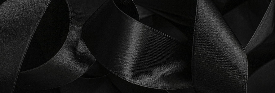 黑丝带作为背景 抽象和奢侈品牌设计皮革黑与白阴影丝带奢华桌面反射曲线丝绸黑色背景图片