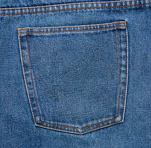 蓝色牛仔裤背口袋 有棕色线缝合背景图片