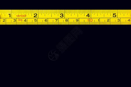 长尺黄标尺上的磁带测量厘米和毫米数金属尺公制建造金属视角学生尺寸学校木工卷尺背景