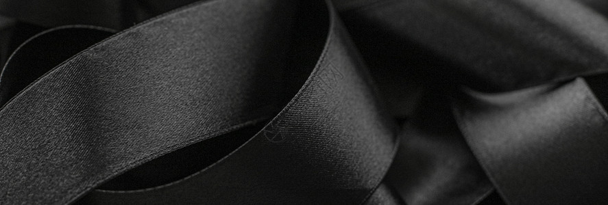 黑丝带作为背景 抽象和奢侈的品牌曲线丝带工作室反射桌面阴影奢华黑与白丝绸黑色背景图片