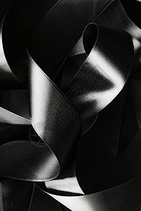黑色和白色丝带作为背景 抽象和奢侈品b丝绸桌面奢华黑与白曲线阴影皮革工作室品牌反射背景图片